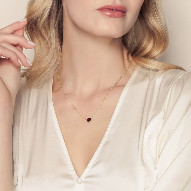 Borsheims garnet necklace on female model