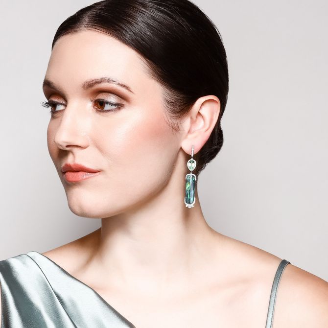Opal earrings on female model