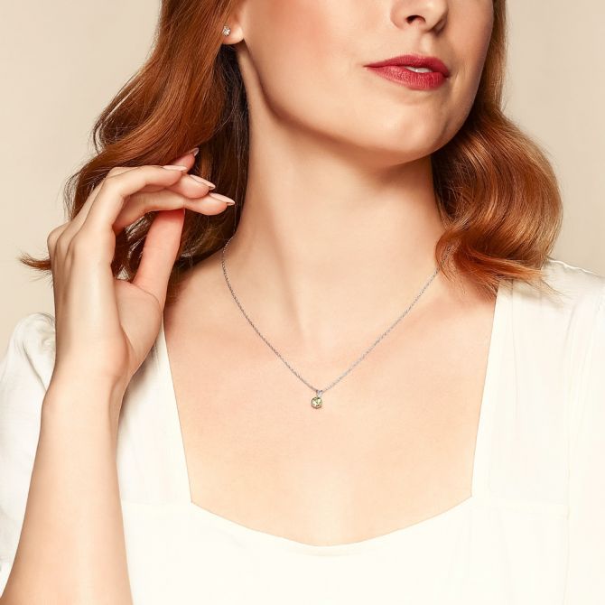 Borsheims peridot necklace on female model