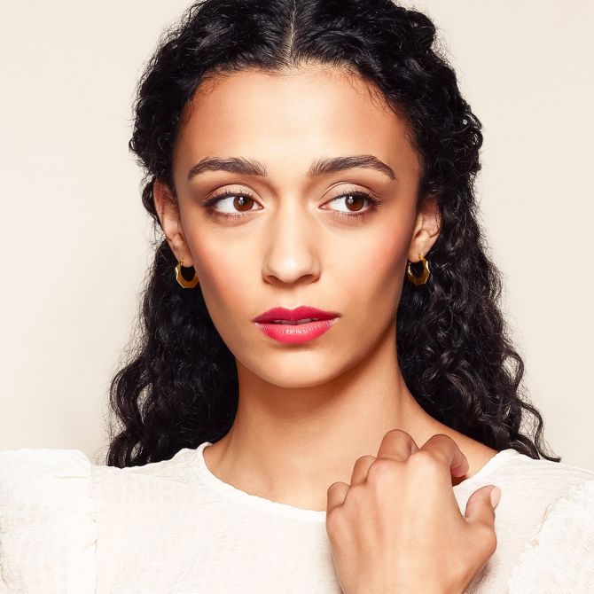 Textured hoop earrings on a model