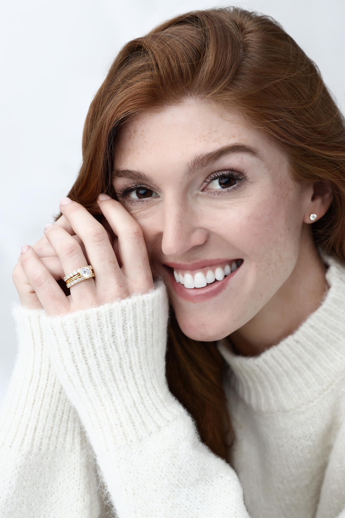 Happy woman posing wearing wedding rings