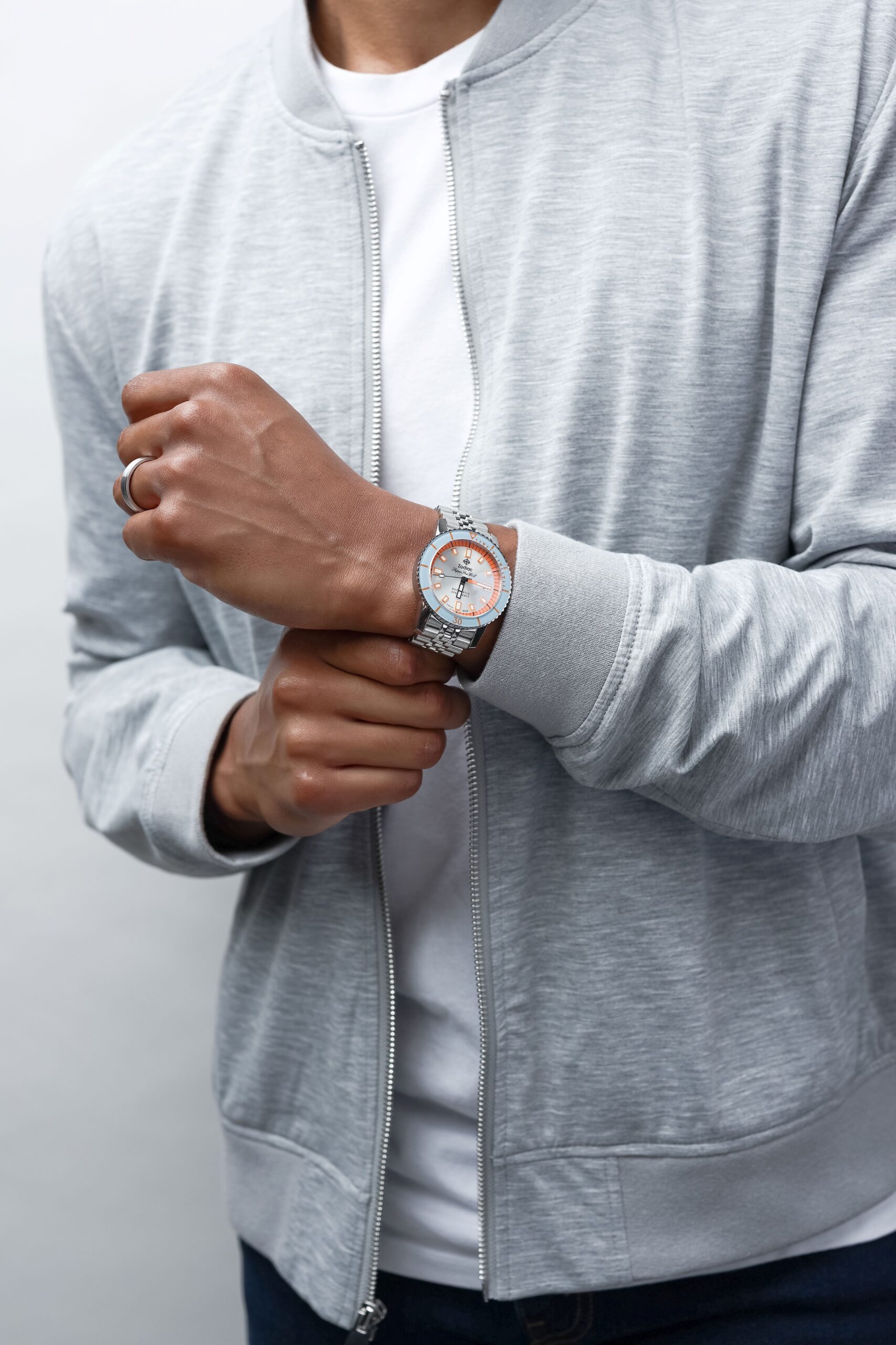 male model posing with a white gold wedding band