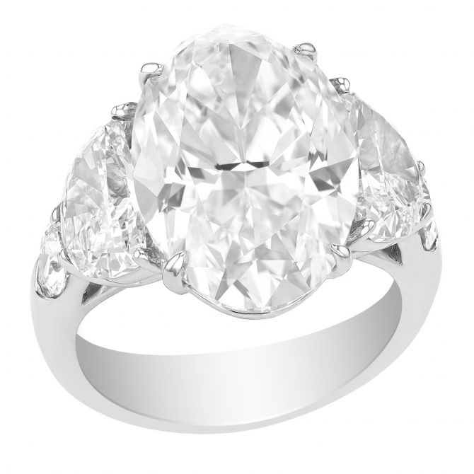 J.B. Star Oval Diamond Engagement Ring with Half Moon & Shield Cut Side Stones in Platinum