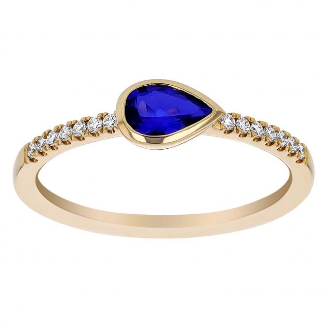 Pear Shaped East West Sapphire Bezel Set Ring with Diamond Sides in Yellow Gold