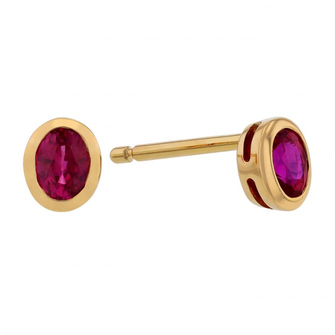 Oval Ruby Bezel Set Stud Earrings in Yellow Gold