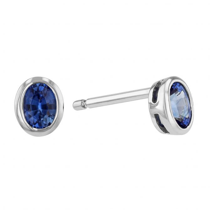 Oval Sapphire Bezel Set Stud Earrings in White Gold