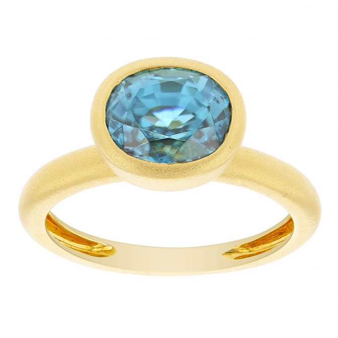 Oval Blue Zircon Bezel Set Ring in Matte Yellow Gold